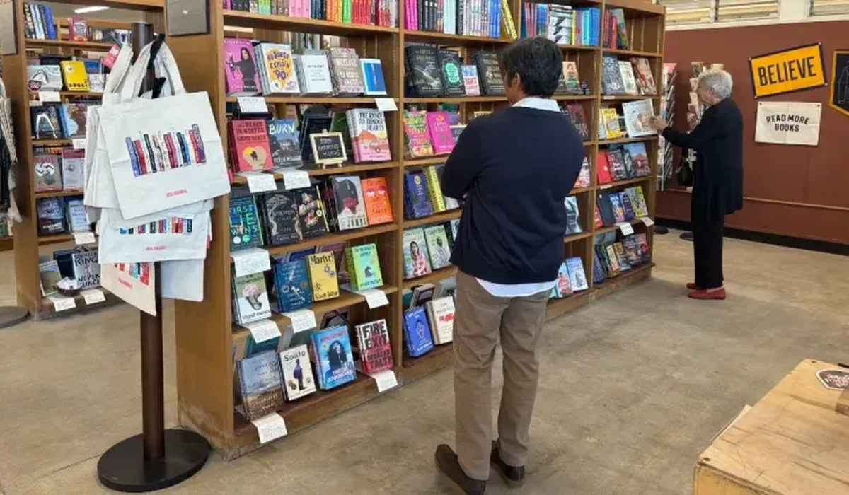 A guest perusing the shelves at the new bookstore. (Photo courtesy of Library Foundation SD)