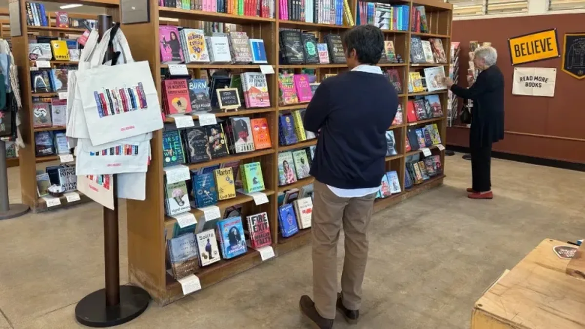 A guest perusing the shelves at the new bookstore. (Photo courtesy of Library Foundation SD)